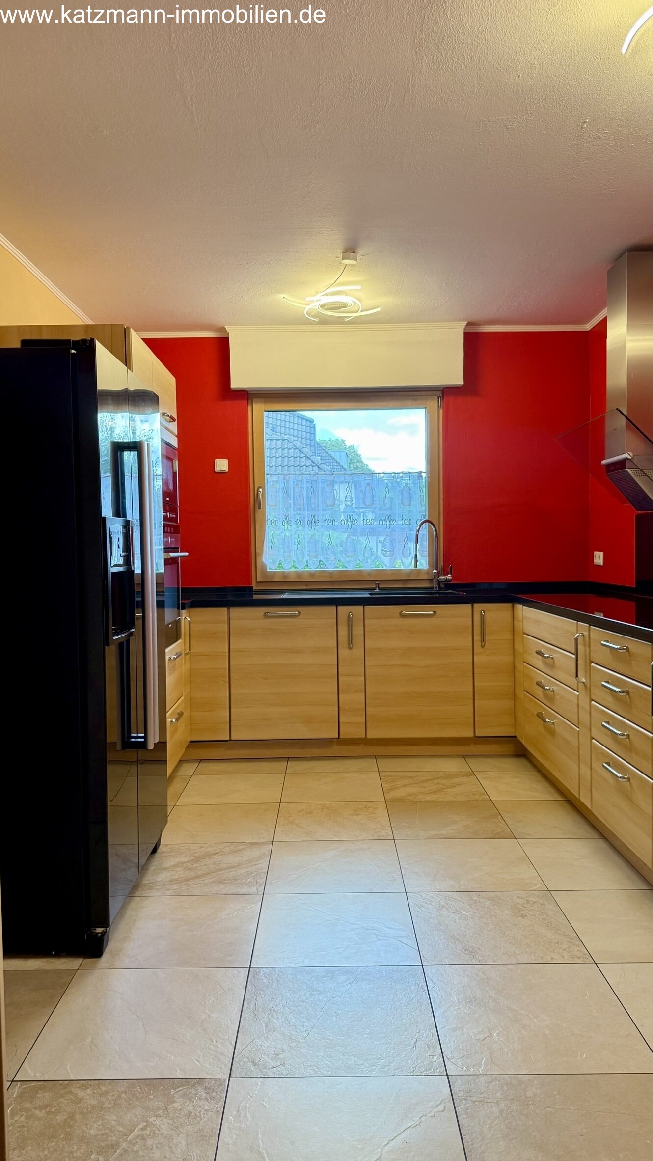 Modern fitted kitchen with panoramic window - functionality meets brightness!