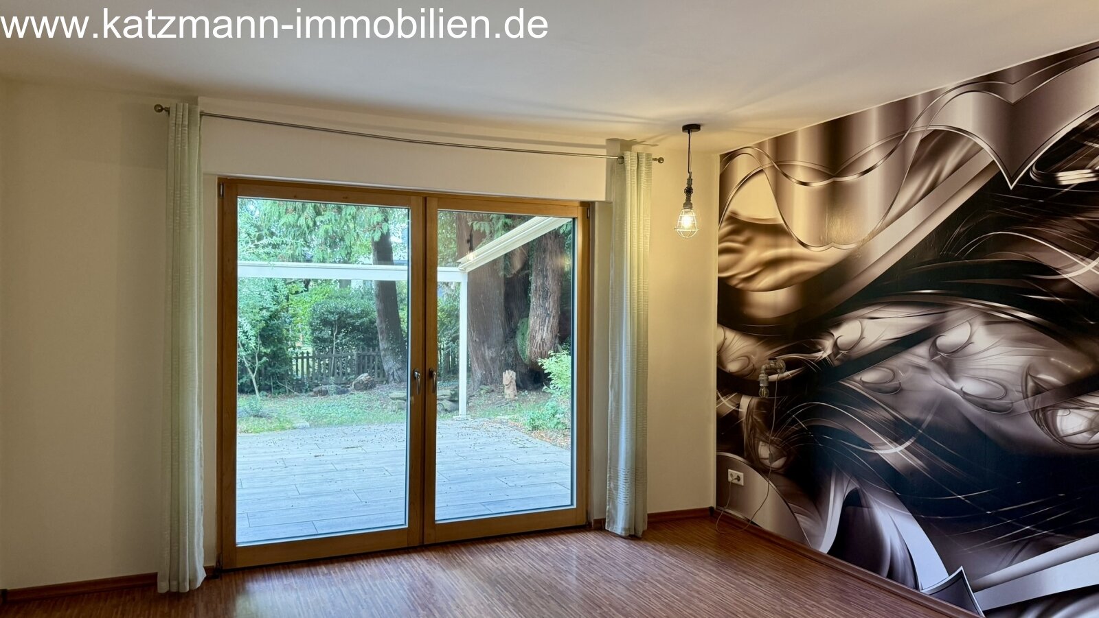 Bright living dream with direct garden access and modern wall art