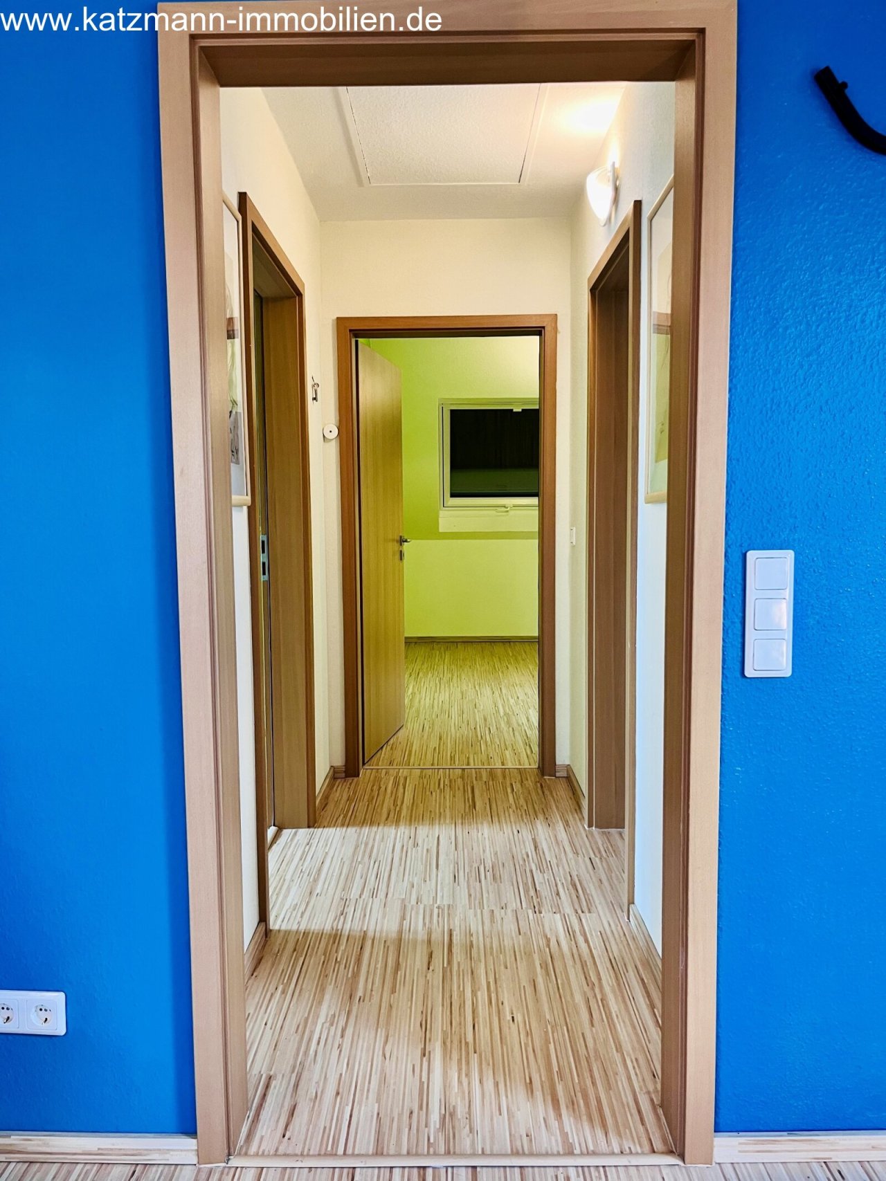 Thoughtful layout: Bright corridor with optimal room allocation and harmonious wooden frames