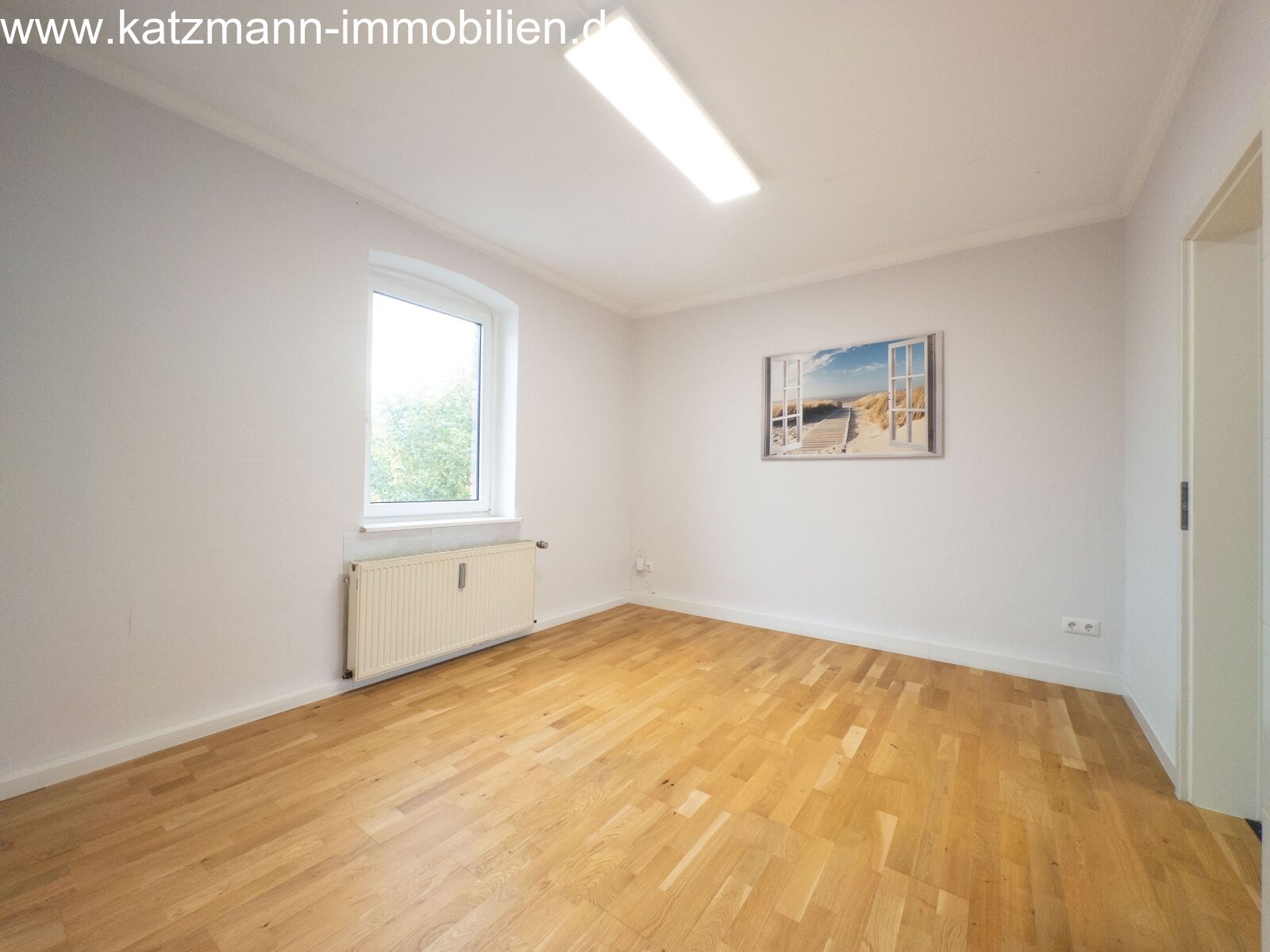 Brightly lit room with high-quality parquet flooring - your new cozy retreat!