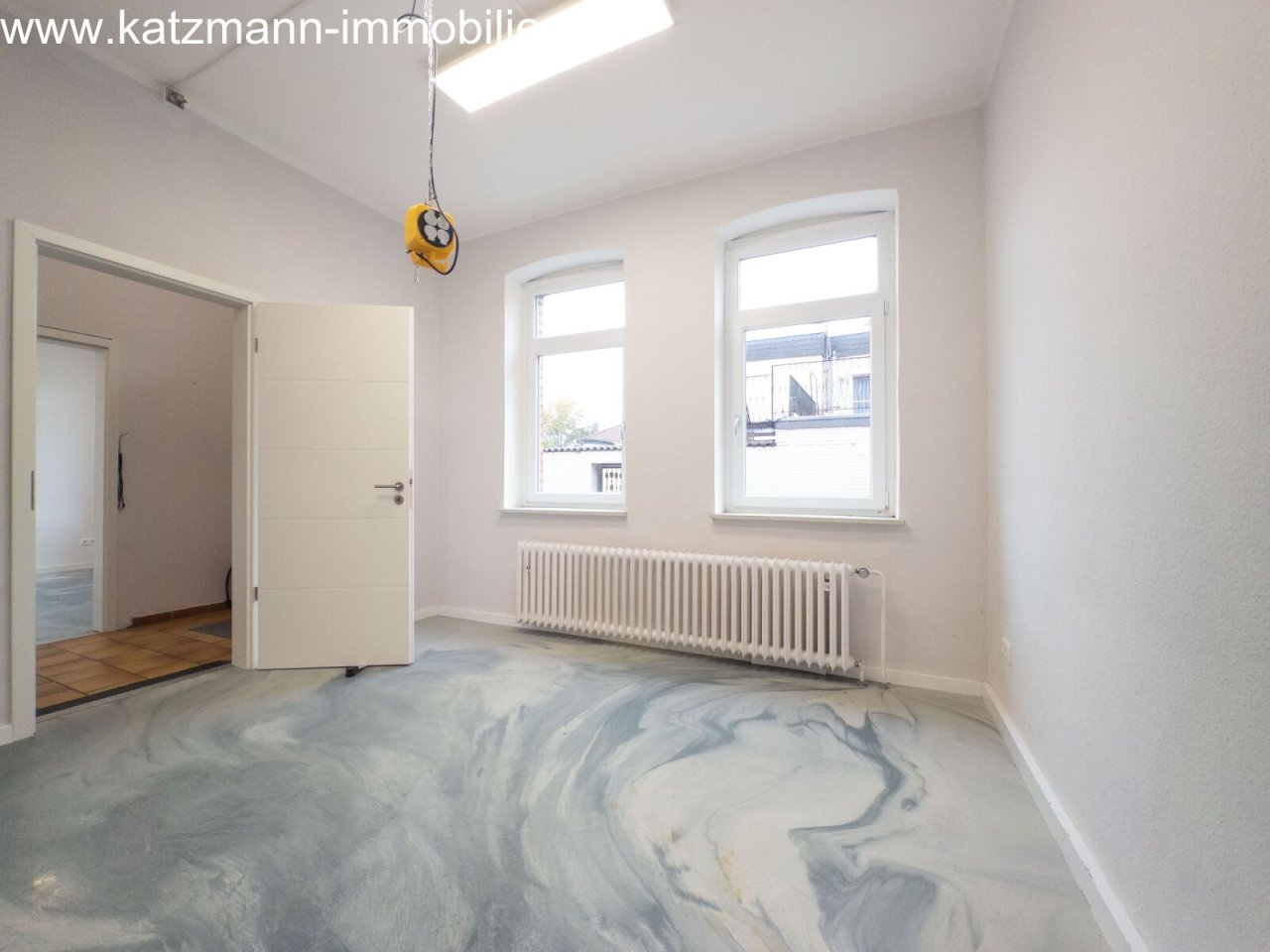 Bright, airy room with potential: modern window front and contemporary heating system included!